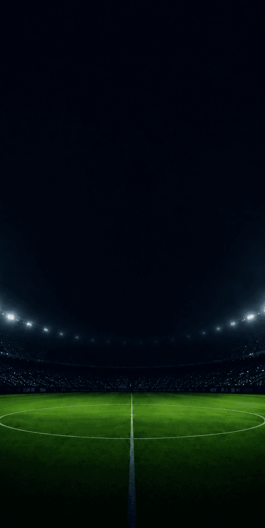 Football pitch under floodlights